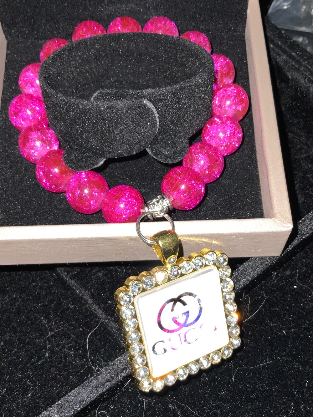 Hot Pink Beaded Bracelet with Gold Rhinestone Logo Charm
